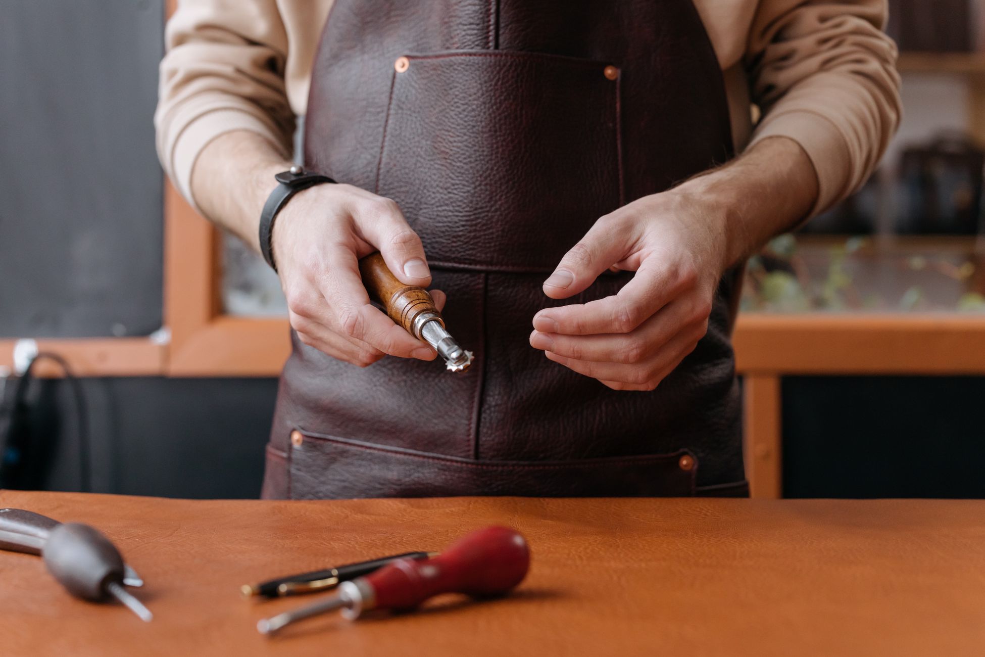 Leather craftsman at the workbench